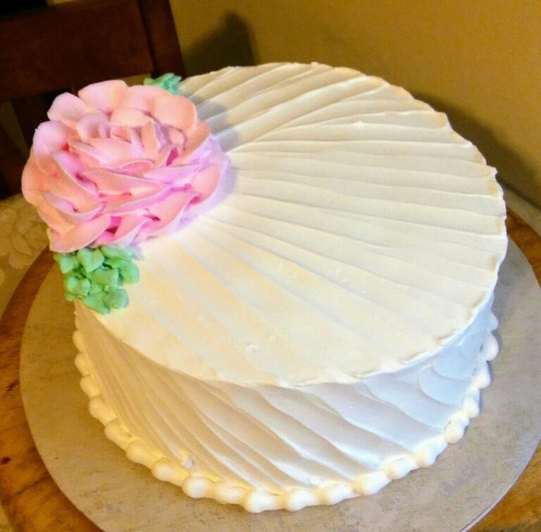 Pink flower on top white color Sympathy Cake